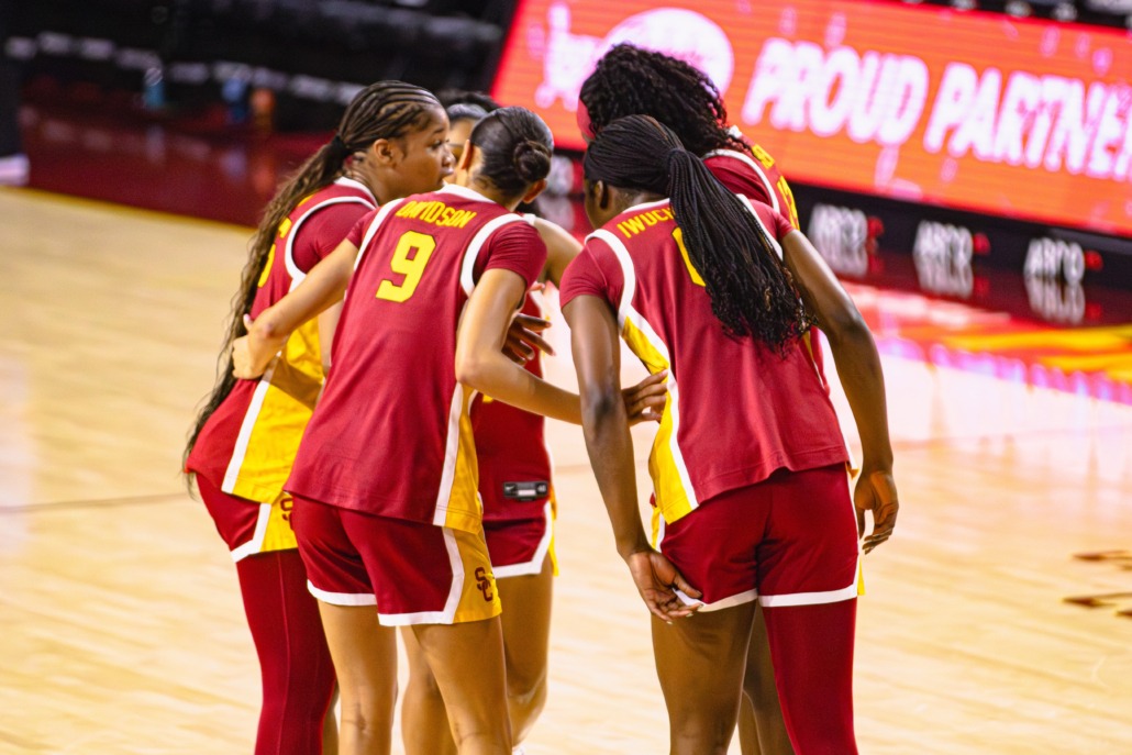 Women's basketball team gathers together.