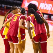Women's basketball team gathers together.
