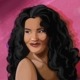 Artist Olivia Dean smiles.