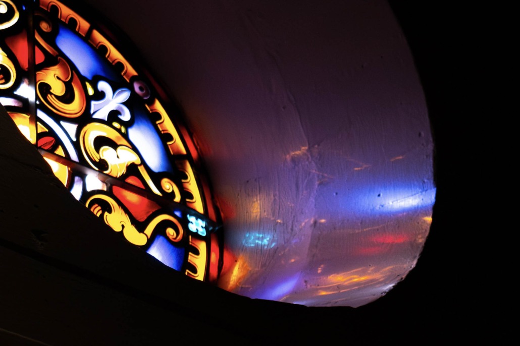 Colorful reflections of stained glass door at Little Chapel of Silence