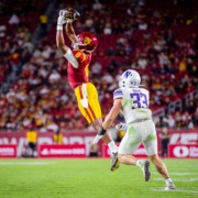 Ja'Kobi Lane makes a leaping catch over a Northwestern defender