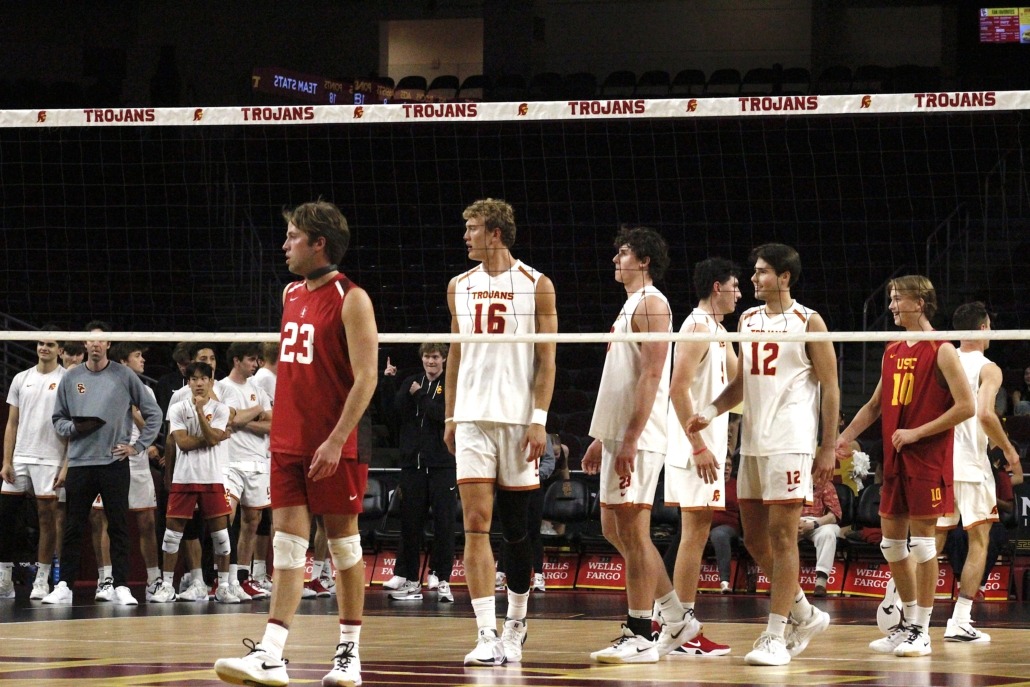 USC men's volleyball gathers in front of the net