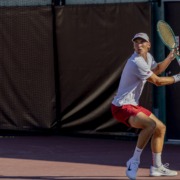 Nathan Trouve hits a tennis ball.