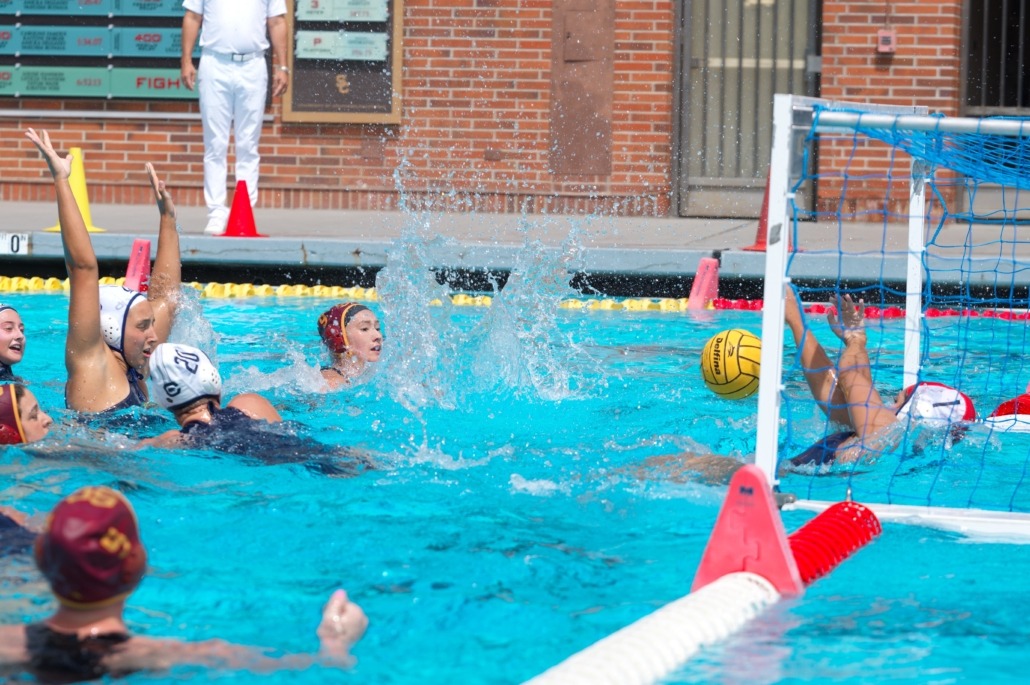 Attacker Emily Ausmus takes a shot and watches it go toward the goal.