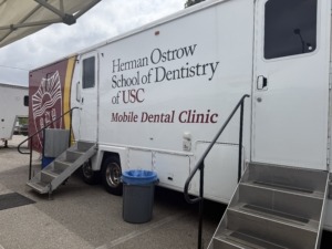 outside of large van with ostrow school of dentistry article