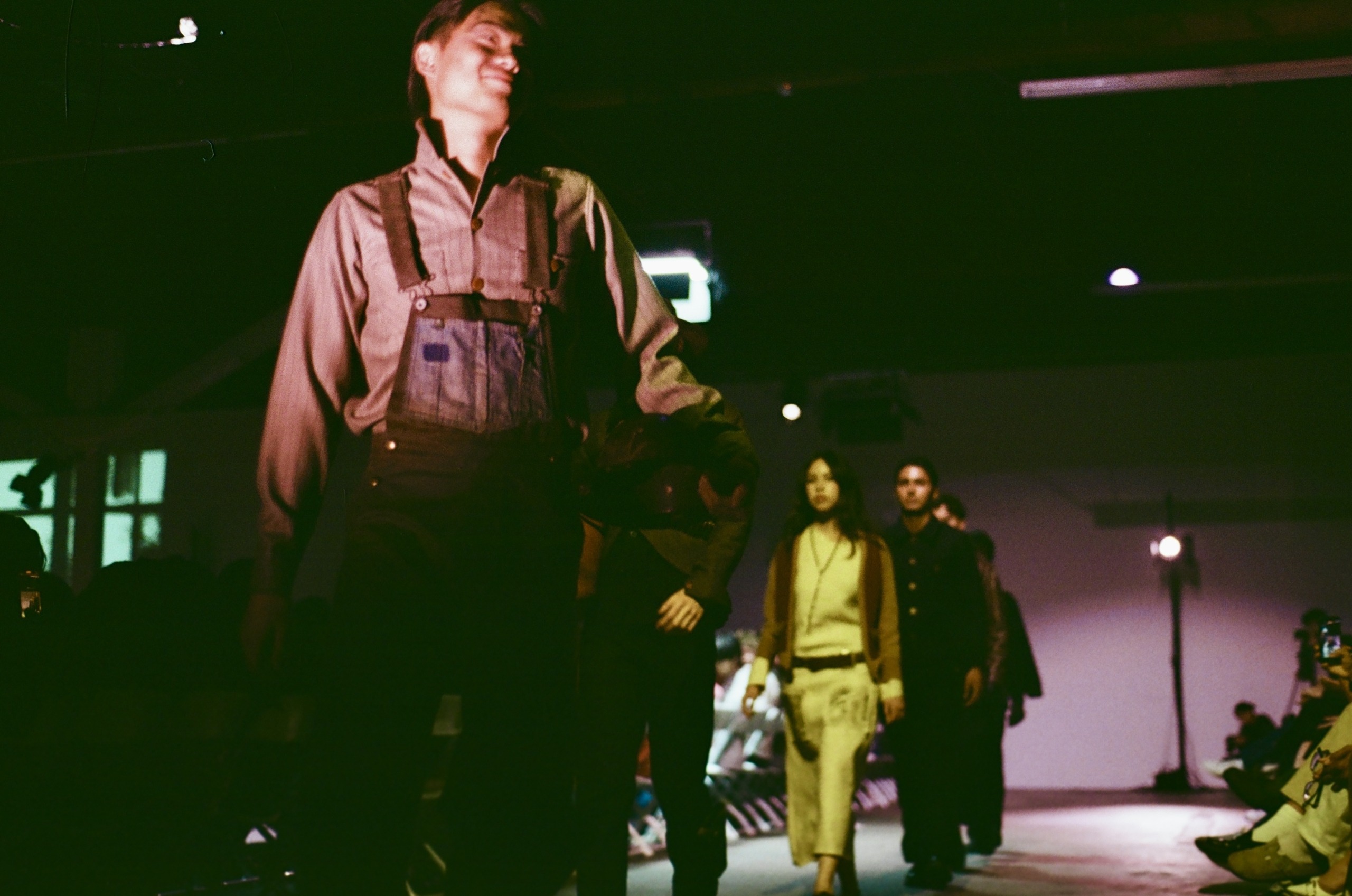 Models walk the FIA fashion show runway.