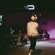 A model walks the runway at the FIA fashion show.