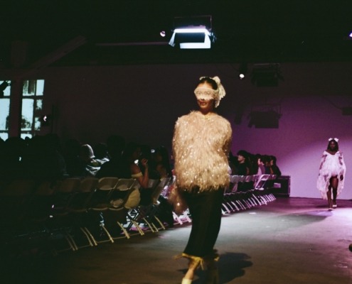 A model walks the runway at the FIA fashion show.