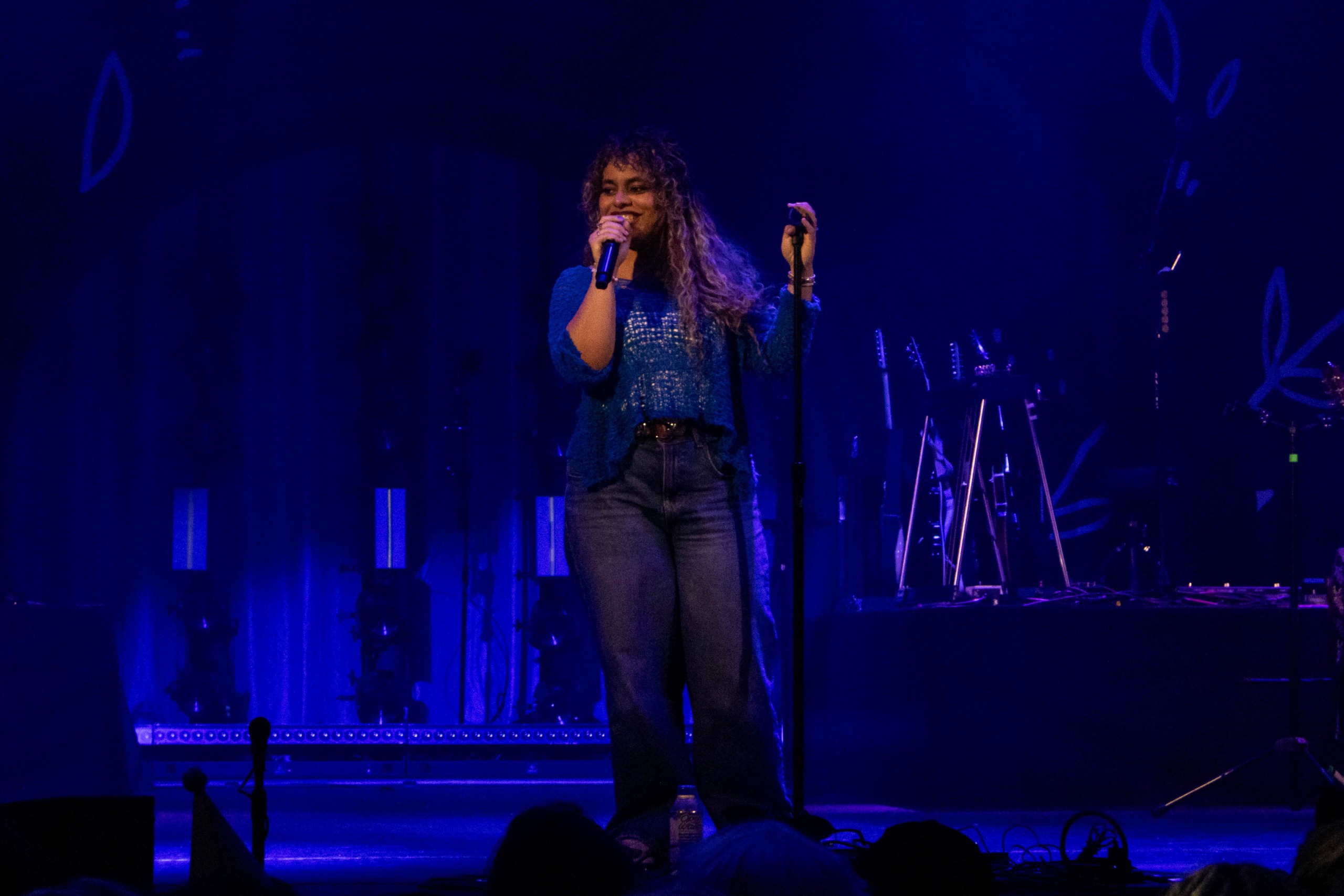 Bella Kay singing on stage.