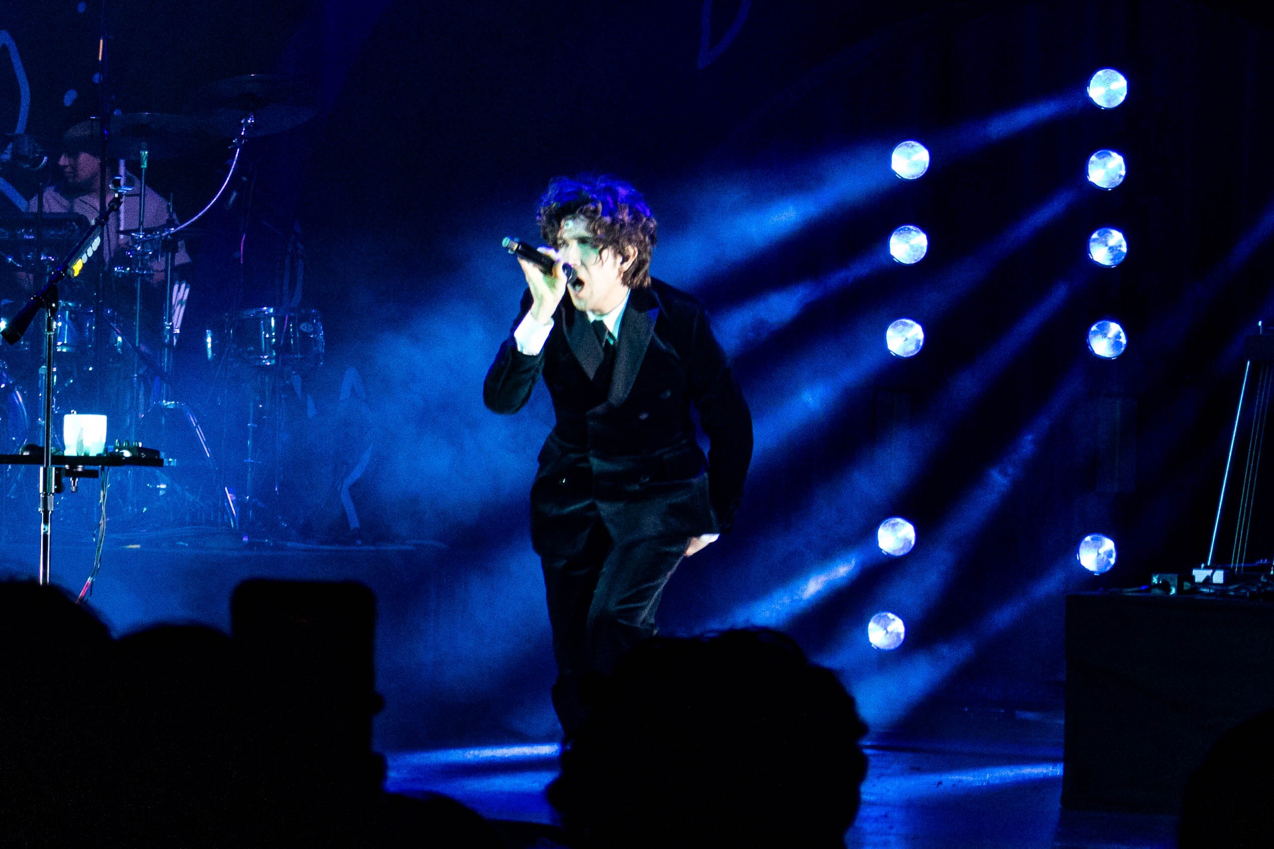 Ricky Montgomery singing on stage.