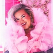 Photo of rising pop star Molly Grace in a pink outfit.