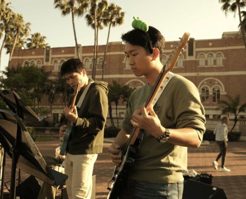 Members of Band Kori playing instruments