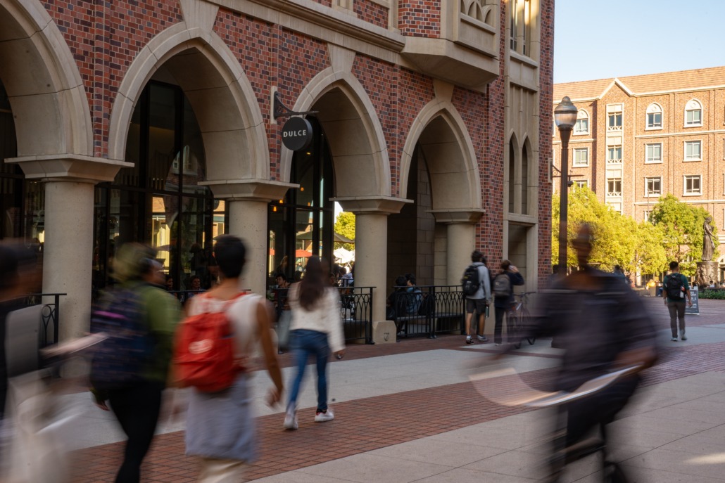 Image of students strolling around USC Village