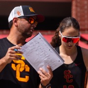 Associate Head Coach Gustavo Rocha talks to a player