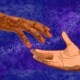 Two hands reaching out to each other.