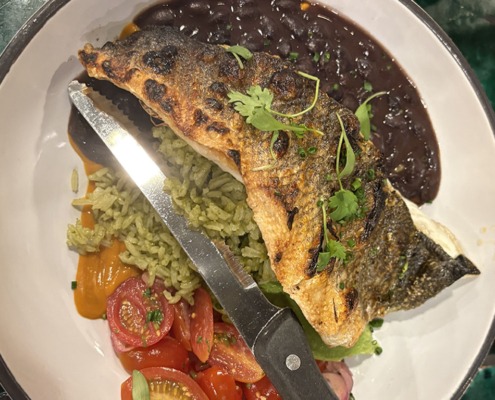Holbox dish including fish, beans, tomatoes and rice.