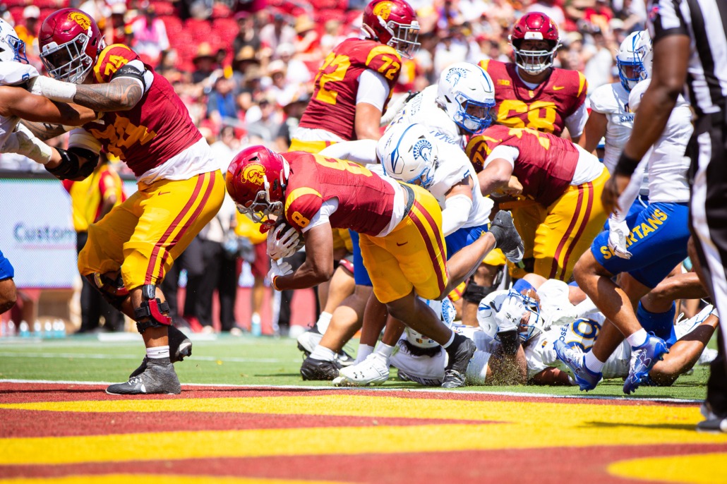 King Miller pushes into the end zone