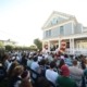 people sit outside chabad house opening