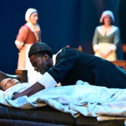 Reverend Paris trying to wake up his daughter Letty.